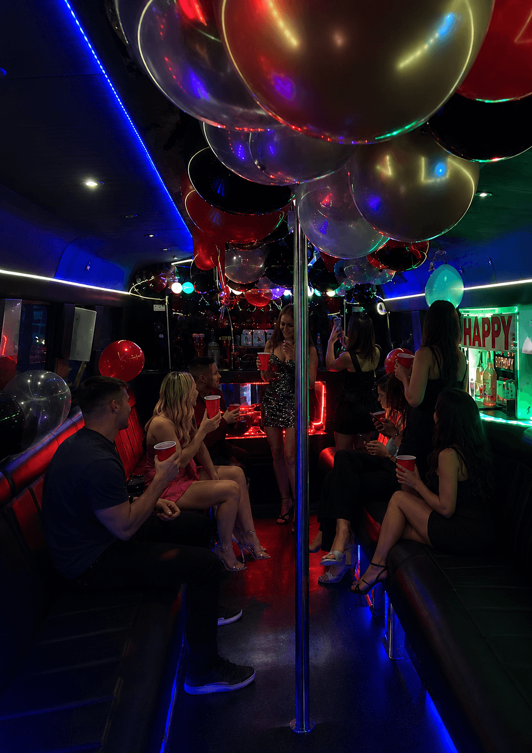 Birthday celebration on board with balloons, drinks and vibrant party lighting